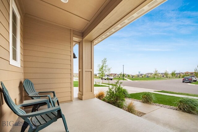 1506 Wild Bill Way, Belgrade, MT 59714 - view of patio featuring a porch and a residential view