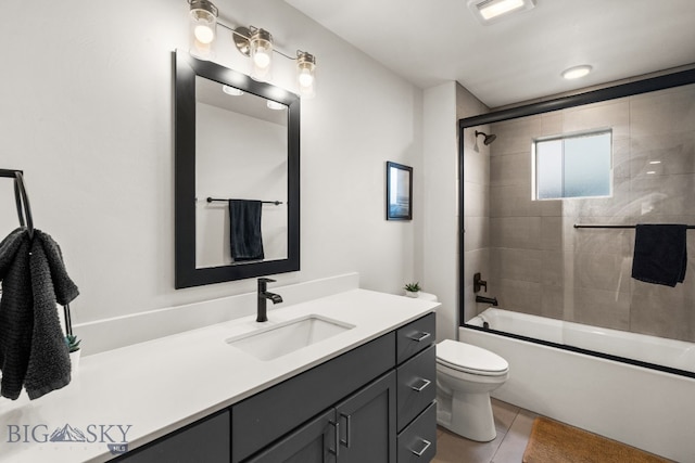 2032 Dennison Ln, Bozeman, MT 59718 - bathroom featuring toilet, vanity, combined bath / shower with glass door, and tile patterned flooring