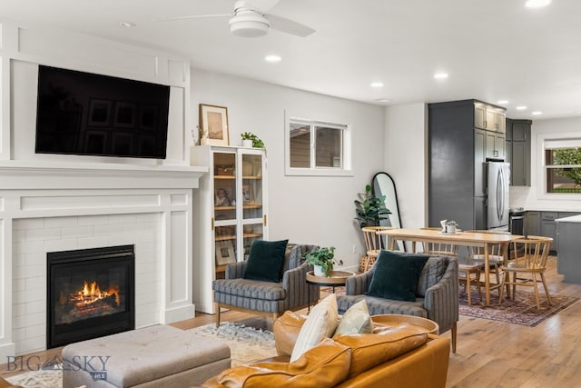 2032 Dennison Ln, Bozeman, MT 59718 - living room with light wood-type flooring, a ceiling fan, recessed lighting, and a tiled fireplace