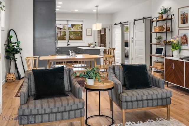2032 Dennison Ln, Bozeman, MT 59718 - living room with a barn door, recessed lighting, and light wood-style floors
