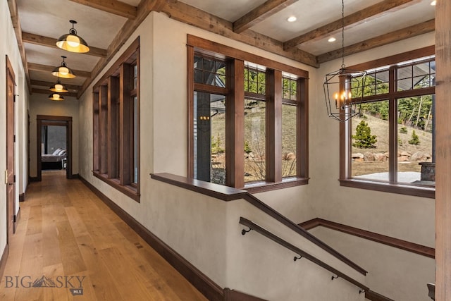1220 Green Valley Way, Bozeman, MT 59715 - corridor with beam ceiling, baseboards, light wood-style flooring, a chandelier, and recessed lighting