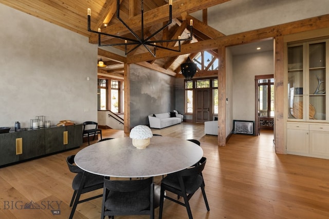1220 Green Valley Way, Bozeman, MT 59715 - dining area with beamed ceiling, plenty of natural light, hardwood / wood-style flooring, high vaulted ceiling, and wooden ceiling