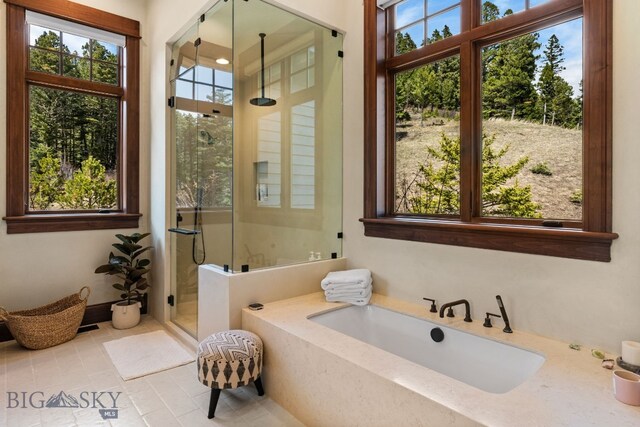 1220 Green Valley Way, Bozeman, MT 59715 - full bathroom featuring a stall shower, a tub, and tile patterned flooring
