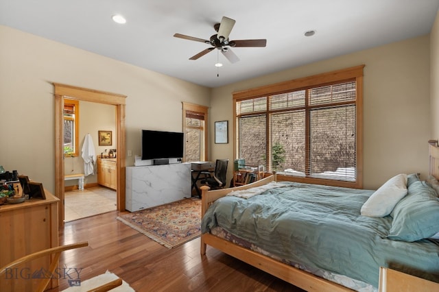 1220 Green Valley Way, Bozeman, MT 59715 - bedroom featuring wood finished floors, recessed lighting, ensuite bath, and a ceiling fan