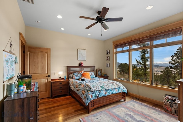 1220 Green Valley Way, Bozeman, MT 59715 - bedroom with wood finished floors, recessed lighting, baseboards, a mountain view, and ceiling fan