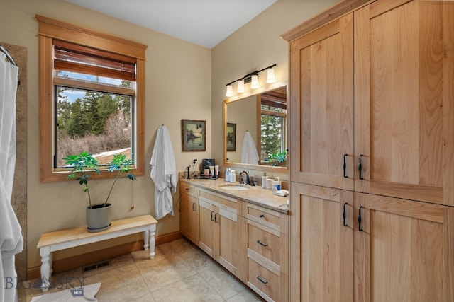 1220 Green Valley Way, Bozeman, MT 59715 - full bathroom featuring plenty of natural light, tile patterned floors, vanity, and baseboards