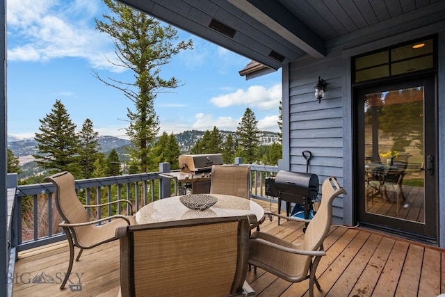 1220 Green Valley Way, Bozeman, MT 59715 - deck featuring a mountain view, grilling area, and outdoor dining space