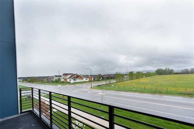 balcony featuring a residential view