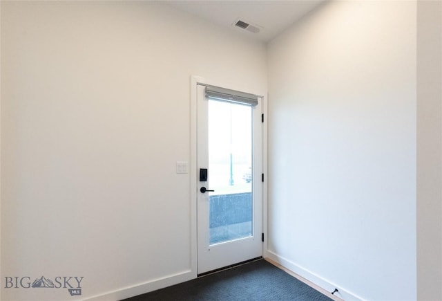empty room with dark carpet