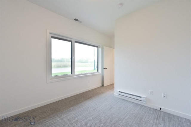unfurnished room with a baseboard radiator, carpet, and baseboards