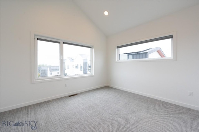unfurnished room featuring carpet floors, baseboards, lofted ceiling, and recessed lighting