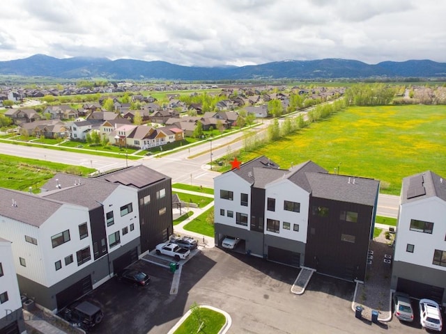 aerial view of residential area featuring mountains