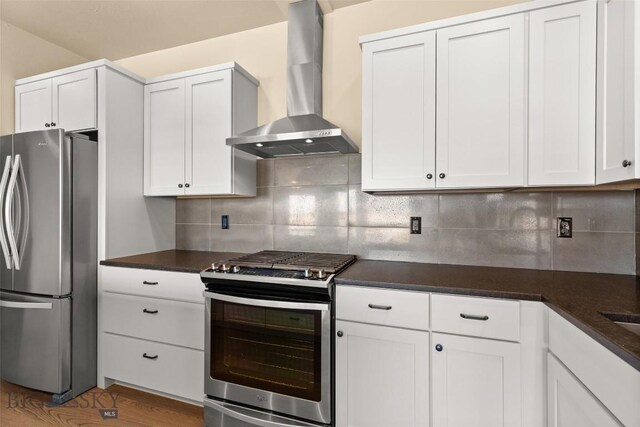 3164 S 15th Ave, Bozeman, MT 59715 - kitchen featuring appliances with stainless steel finishes, wall chimney exhaust hood, dark countertops, and white cabinets