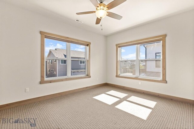 3164 S 15th Ave, Bozeman, MT 59715 - empty room with light carpet, baseboards, and a ceiling fan