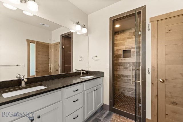 3164 S 15th Ave, Bozeman, MT 59715 - full bath with a stall shower, double vanity, and wood finished floors