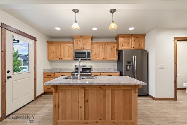 kitchen featuring appliances with stainless steel finishes, light wood-style floors, baseboards, and recessed lighting