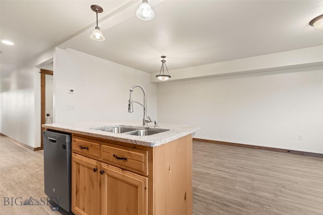 kitchen with a sink, dishwasher, light wood finished floors, and hanging light fixtures