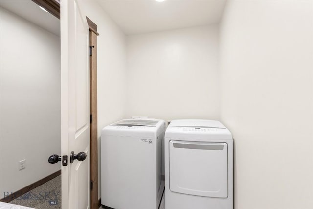 laundry room featuring separate washer and dryer