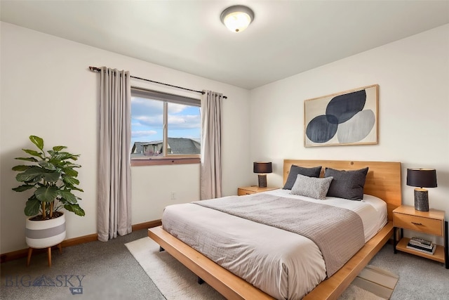 carpeted bedroom featuring baseboards