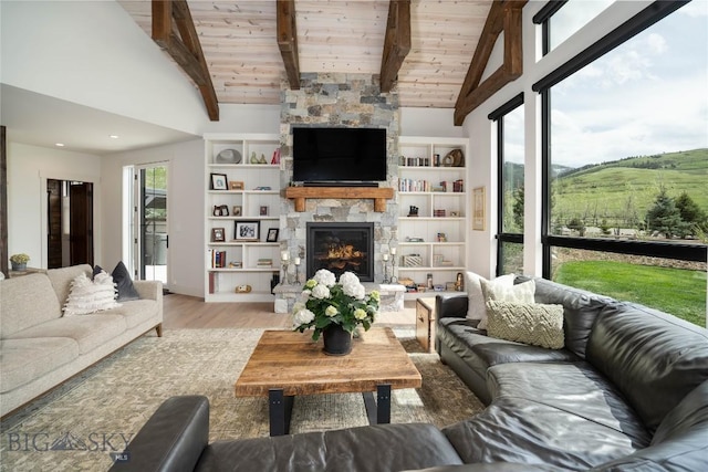 17450 Wilson Creek Rd, Gallatin Gateway, MT 59730 - living area with wooden ceiling, light wood-style floors, a fireplace, and built in features