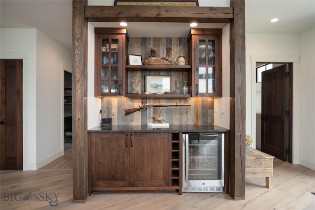 17450 Wilson Creek Rd, Bozeman, MT 59730 - indoor bar with wine cooler, light wood-style floors, backsplash, baseboards, and recessed lighting