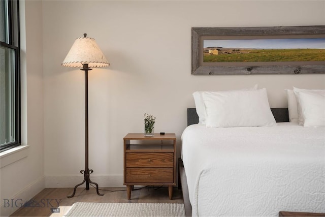 17450 Wilson Creek Rd, Gallatin Gateway, MT 59730 - bedroom featuring wood finished floors and baseboards