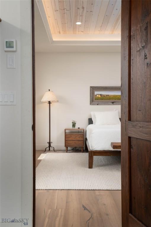 17450 Wilson Creek Rd, Gallatin Gateway, MT 59730 - bedroom with wood finished floors and wood ceiling