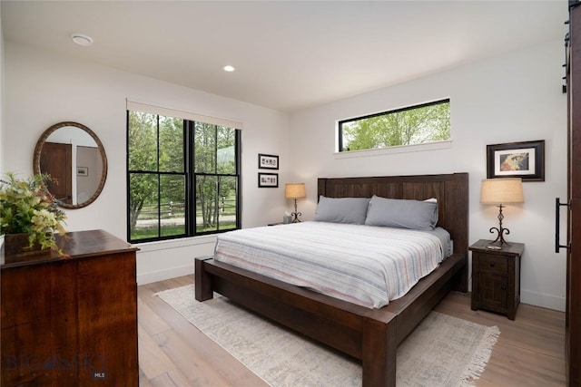 17450 Wilson Creek Rd, Gallatin Gateway, MT 59730 - bedroom featuring multiple windows, light wood finished floors, and recessed lighting