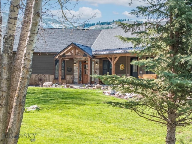 17450 Wilson Creek Rd, Gallatin Gateway, MT 59730 - view of front of house with a shingled roof, a front lawn, a standing seam roof, and a metal roof