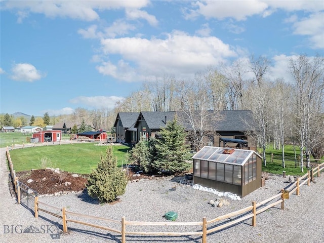 17450 Wilson Creek Rd, Gallatin Gateway, MT 59730 - rear view of property with a greenhouse, an outbuilding, and a shingled roof