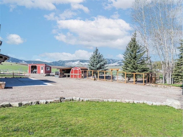 17450 Wilson Creek Rd, Bozeman, MT 59730 - view of home's community with an outbuilding, a mountain view, and a shed