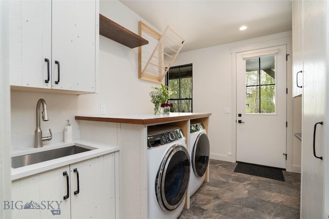 17450 Wilson Creek Rd, Bozeman, MT 59730 - clothes washing area with washing machine and dryer, cabinet space, recessed lighting, and dark stone finish floors