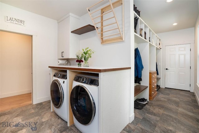 17450 Wilson Creek Rd, Gallatin Gateway, MT 59730 - laundry room with independent washer and dryer, stone finish floors, recessed lighting, and cabinet space