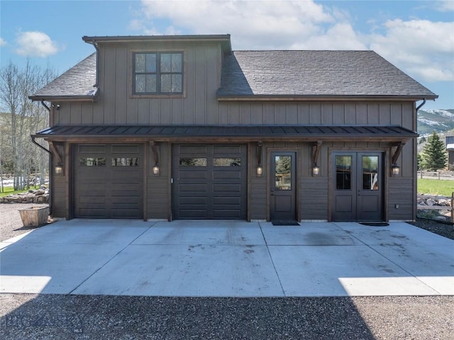 17450 Wilson Creek Rd, Gallatin Gateway, MT 59730 - chalet / cabin featuring driveway, board and batten siding, roof with shingles, and a standing seam roof
