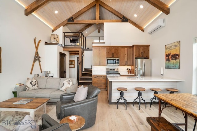 17450 Wilson Creek Rd, Gallatin Gateway, MT 59730 - living area with high vaulted ceiling, a wall unit AC, light wood-type flooring, recessed lighting, and a wood ceiling with exposed beams