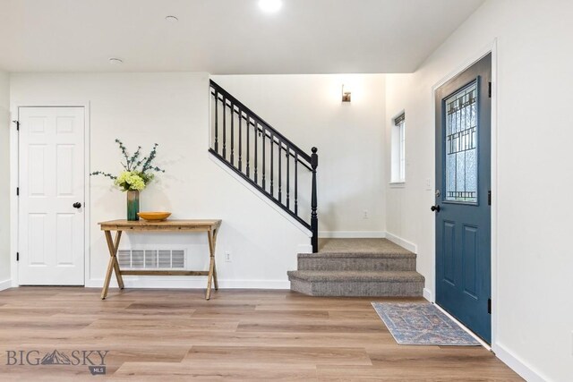 185 Chestnut Grove Ave, Bozeman, MT 59718 - entrance foyer with stairs, wood finished floors, and baseboards
