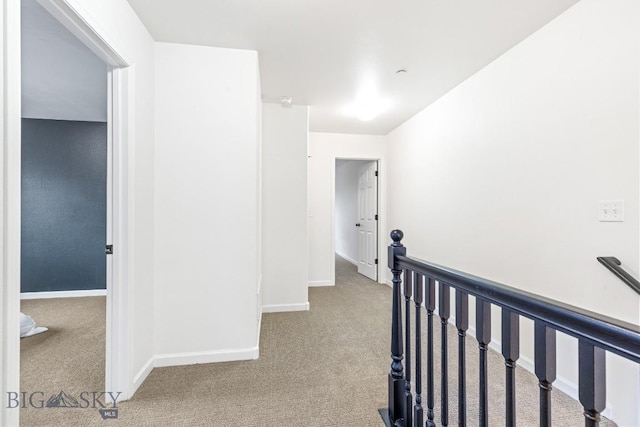 185 Chestnut Grove Ave, Bozeman, MT 59718 - hallway with carpet floors, an upstairs landing, and baseboards