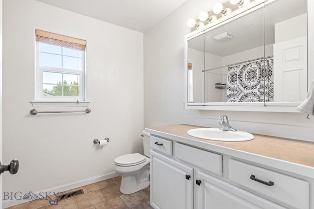 185 Chestnut Grove Ave, Bozeman, MT 59718 - full bath with baseboards, vanity, toilet, and curtained shower