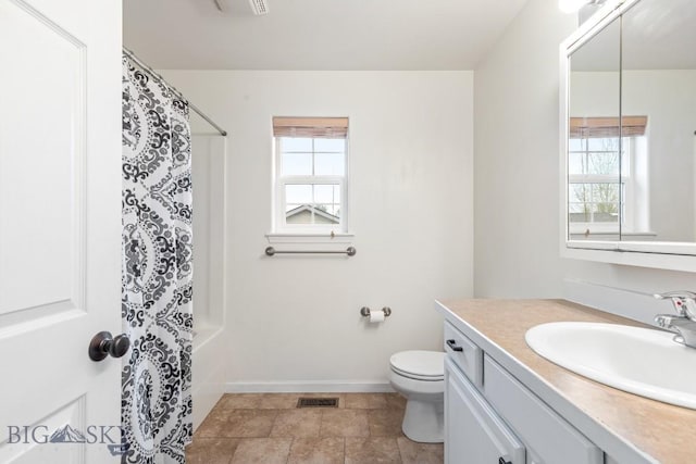185 Chestnut Grove Ave, Bozeman, MT 59718 - bathroom featuring healthy amount of natural light, vanity, toilet, and baseboards
