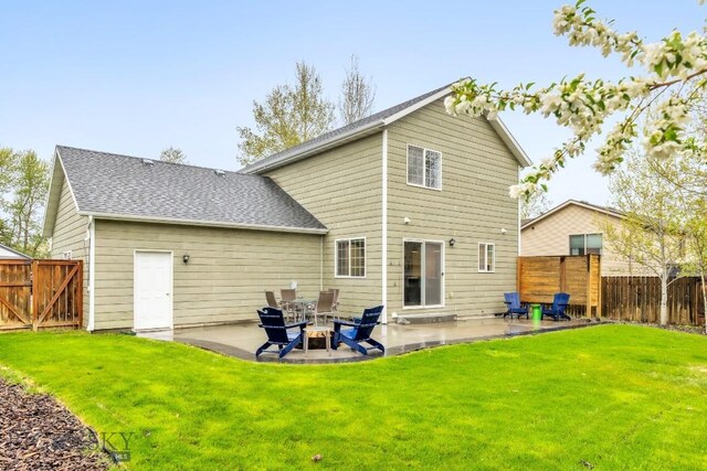 185 Chestnut Grove Ave, Bozeman, MT 59718 - back of property featuring a patio, a fenced backyard, and a shingled roof