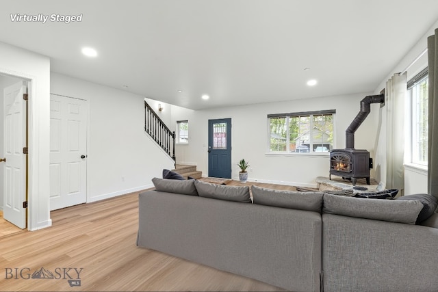 185 Chestnut Grove Ave, Bozeman, MT 59718 - living area featuring a wood stove, stairway, light wood-style flooring, and recessed lighting