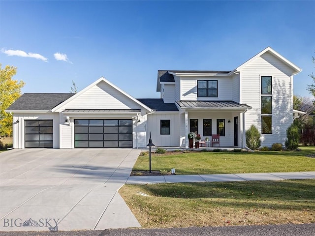 4054 Rain Roper Dr, Bozeman, MT 59715 - modern farmhouse style home with a garage, a porch, driveway, a front yard, and board and batten siding