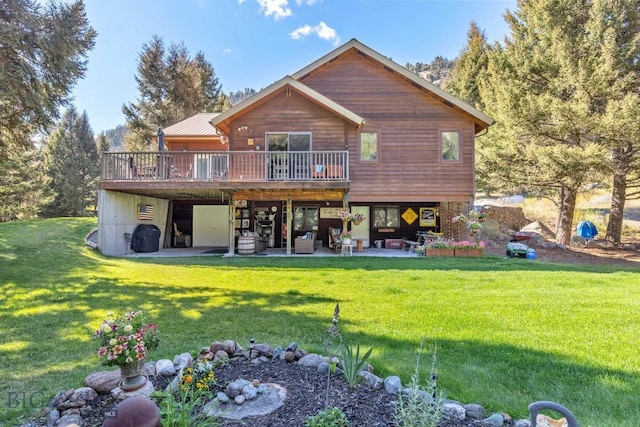 486 Jardine Rd, Jardine, MT 59030 - rear view of property featuring a wooden deck, a patio area, and a lawn