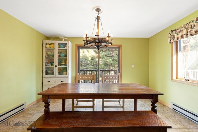486 Jardine Rd, Jardine, MT 59030 - dining room featuring baseboard heating, a chandelier, and plenty of natural light