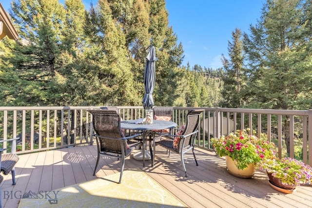 486 Jardine Rd, Jardine, MT 59030 - wooden terrace featuring outdoor dining area