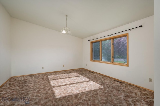 607 N Hoffman St, Belgrade, MT 59714 - carpeted empty room featuring lofted ceiling, a chandelier, and baseboards