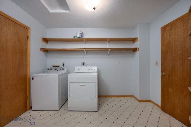 607 N Hoffman St, Belgrade, MT 59714 - washroom with washing machine and clothes dryer, light flooring, and baseboards