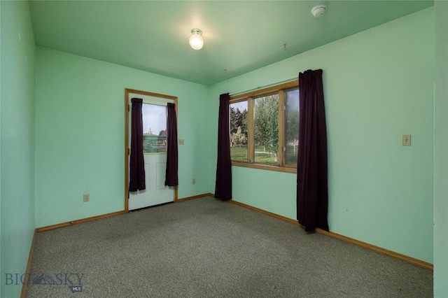 607 N Hoffman St, Belgrade, MT 59714 - empty room featuring healthy amount of natural light, carpet floors, and baseboards