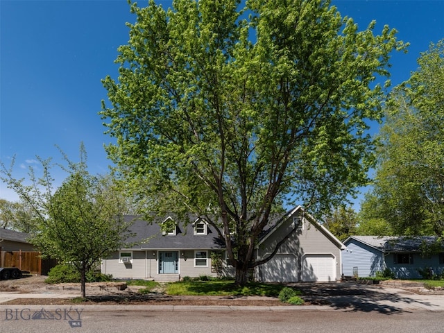 507 Flathead Ave, Bozeman, MT 59718 - cape cod-style house featuring a garage and driveway