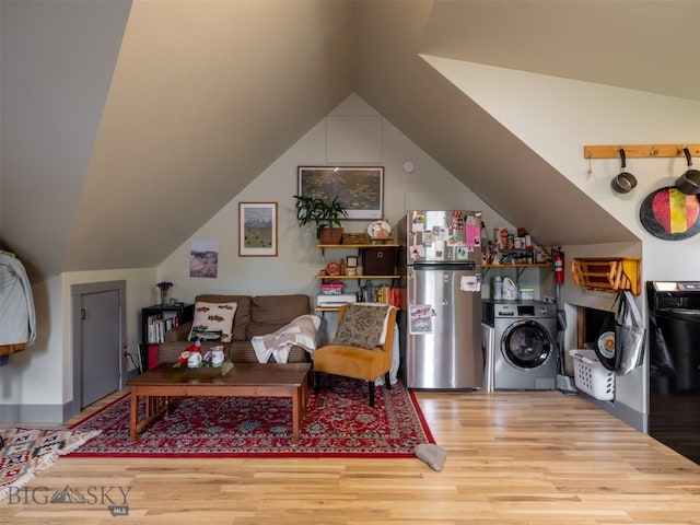 507 Flathead Ave, Bozeman, MT 59718 - living room with washer / dryer, wood finished floors, and lofted ceiling